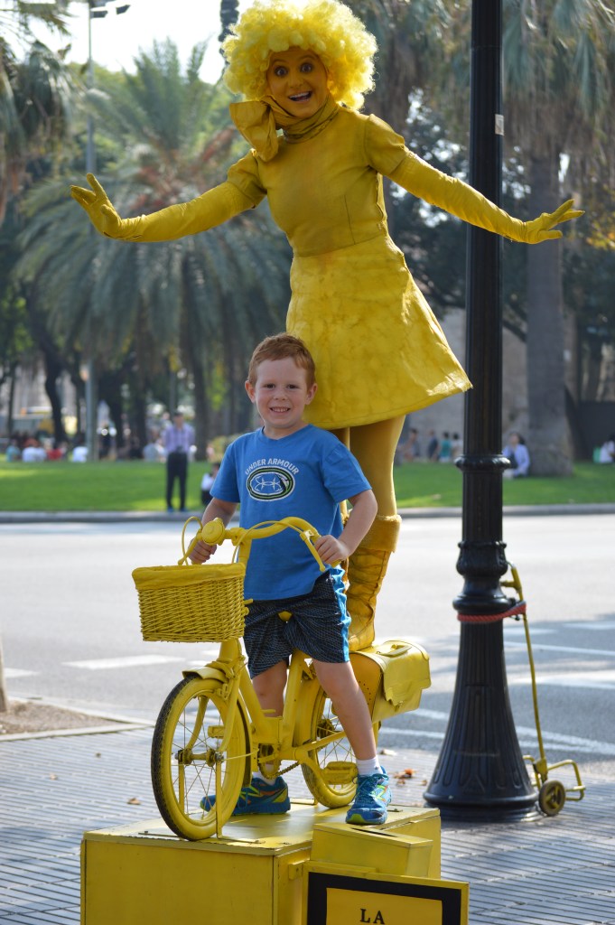 One of my favorites because of her sunny disposition.  After Raleigh put money in her cup she encouraged him to get on the bike.