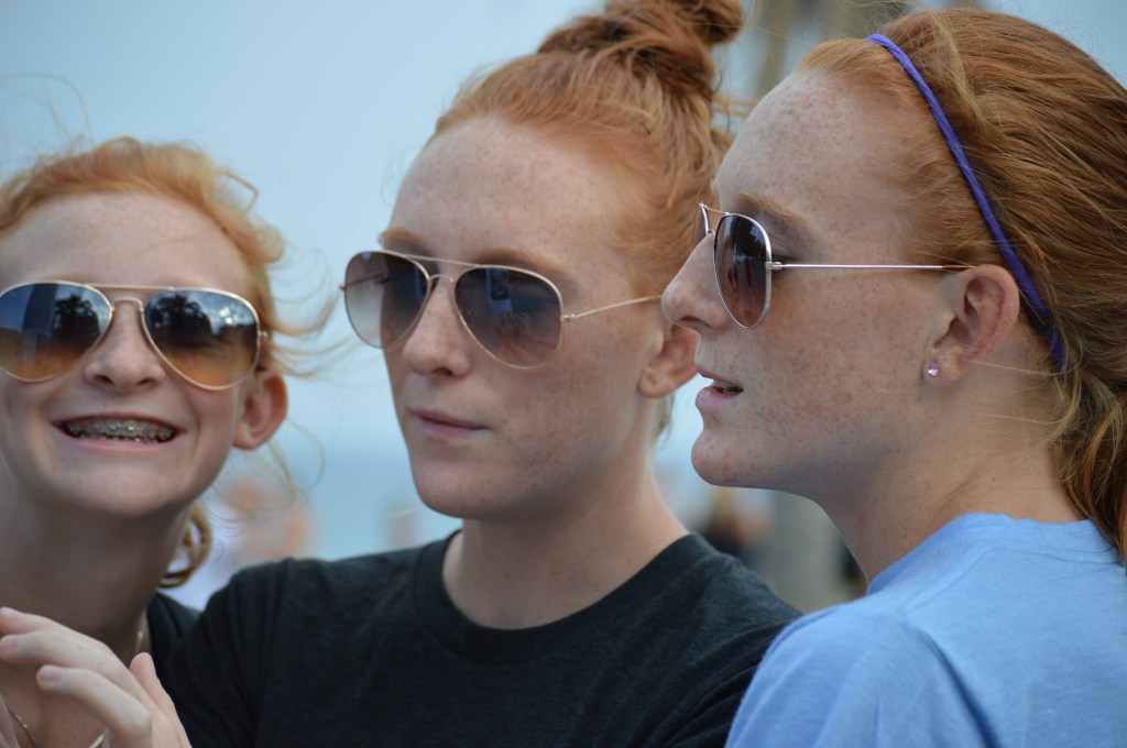 Indi and Ireland using their Spanish skills to translate a lost pet sign.